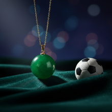 Load image into Gallery viewer, Green jade sphere pendant on dark velvet with soccer ball – Healing Emerald